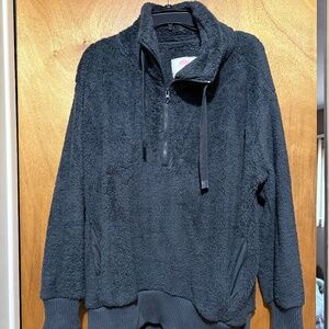 Gray fleece pullover with pocket.